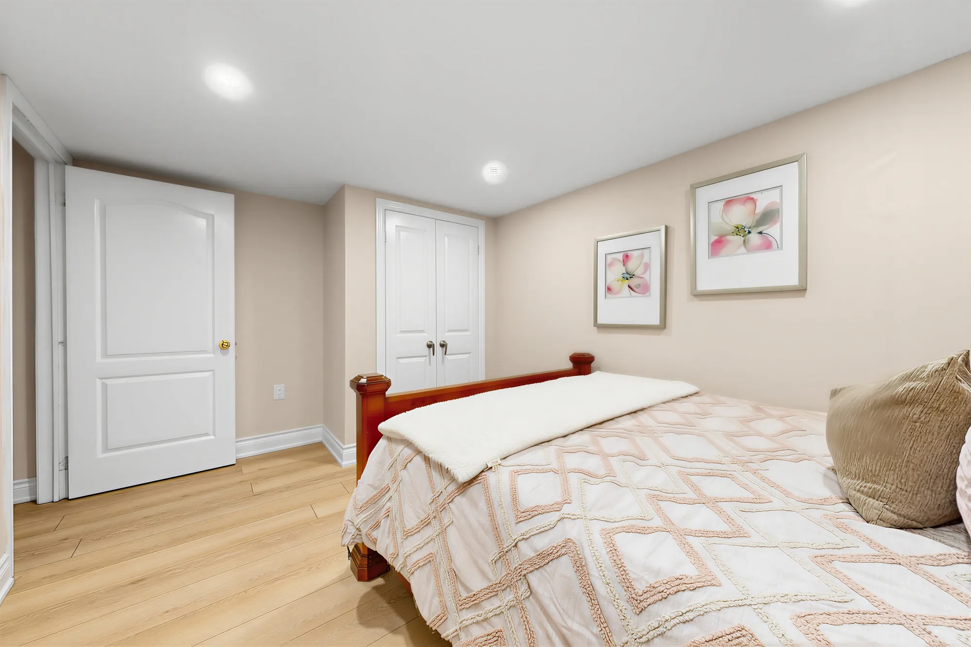 The same bedroom toward the door and a double closet