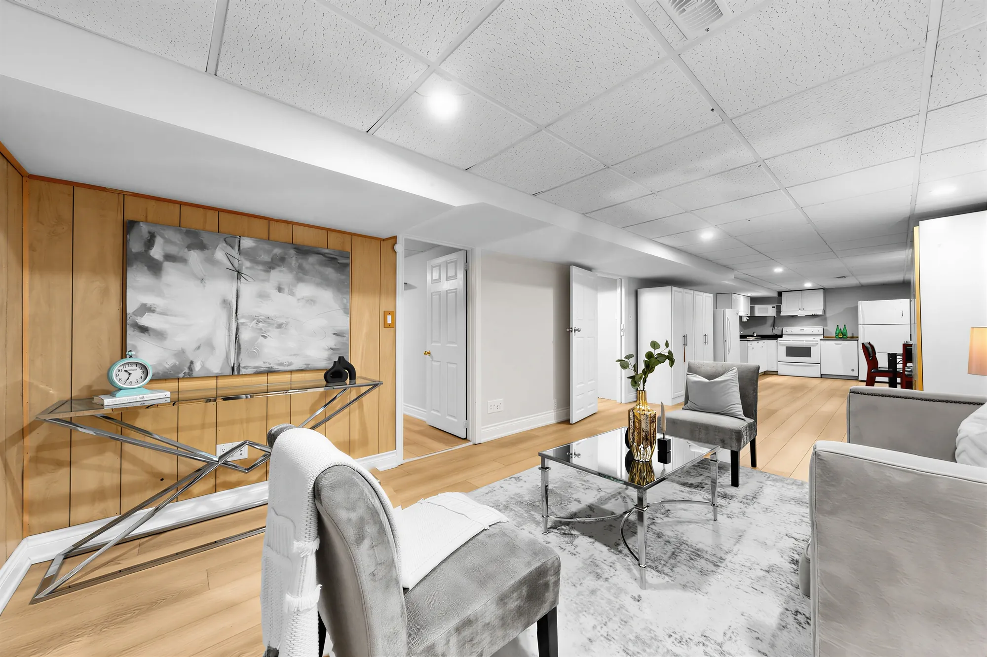 From the family room down the long room to the dining table and the kitchen at the far end